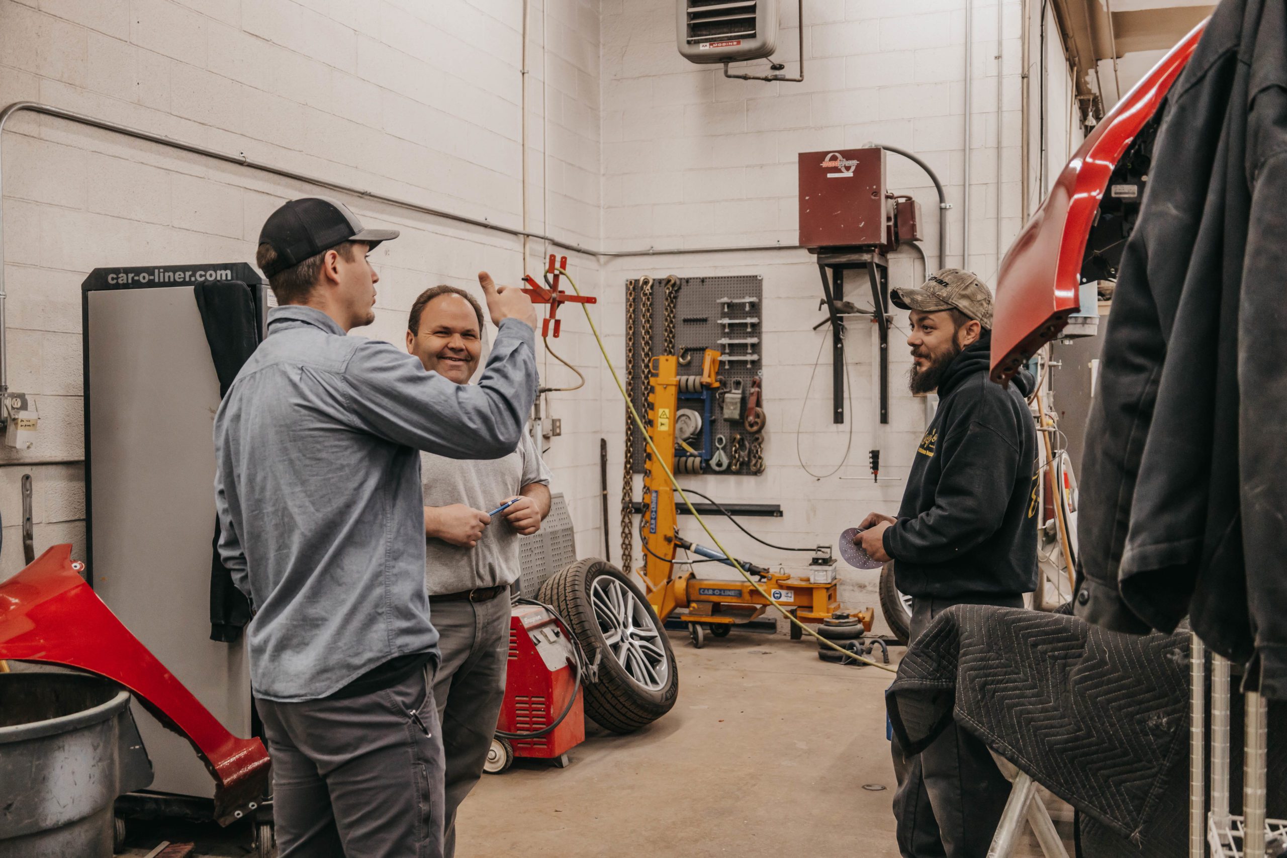 collision shop technicians chatting